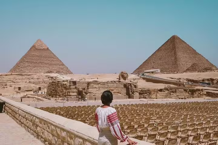 Panoramic view of Giza pyramids from the Grand Egyptian Museum terrace on a private guided Cairo tour