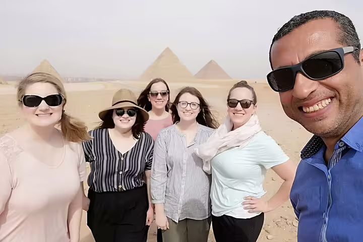 Group selfie at Giza Pyramids with private guide, part of customized 3-day Cairo Giza Alexandria tour