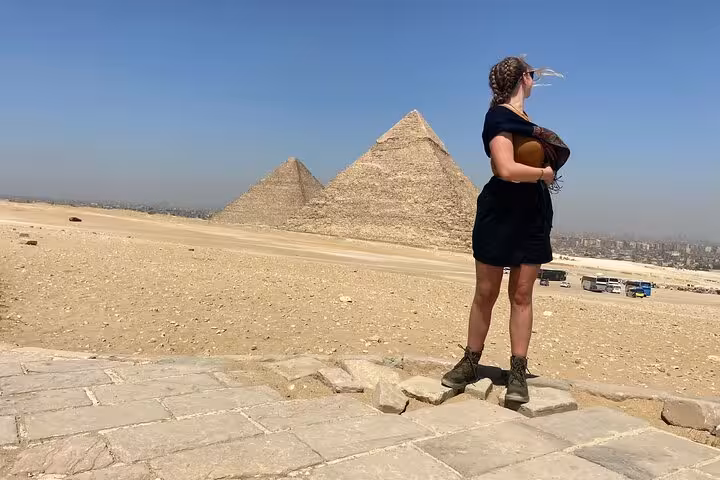 Tourist overlooking Giza pyramids panorama on VIP Giza Pyramids Wonders tour with Grand Egyptian Museum