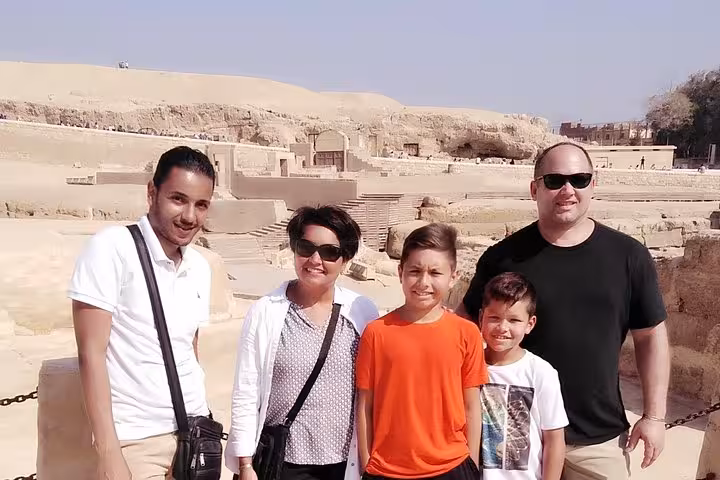 Family with private guide at Giza Plateau on pyramids day trip with entry tickets, camel ride, quad and lunch