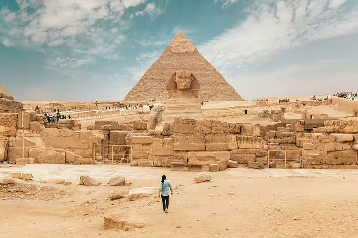 Great Sphinx and Great Pyramid of Giza under blue sky, iconic stop on Cairo day tour with camel ride