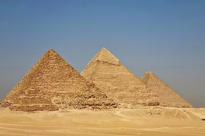 Panoramic view of the Giza Pyramids under clear sky on a private guided tour from Cairo airport or hotel