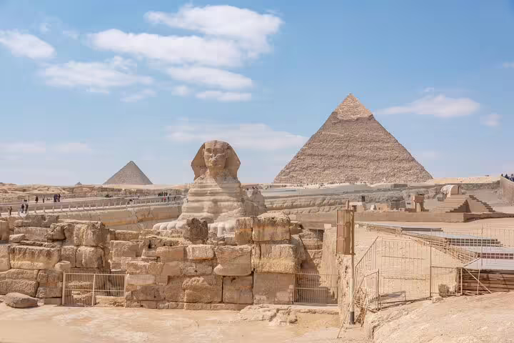 Great Sphinx and Giza Pyramids under blue sky, highlight stop on El Sokhna port shore excursion to Cairo