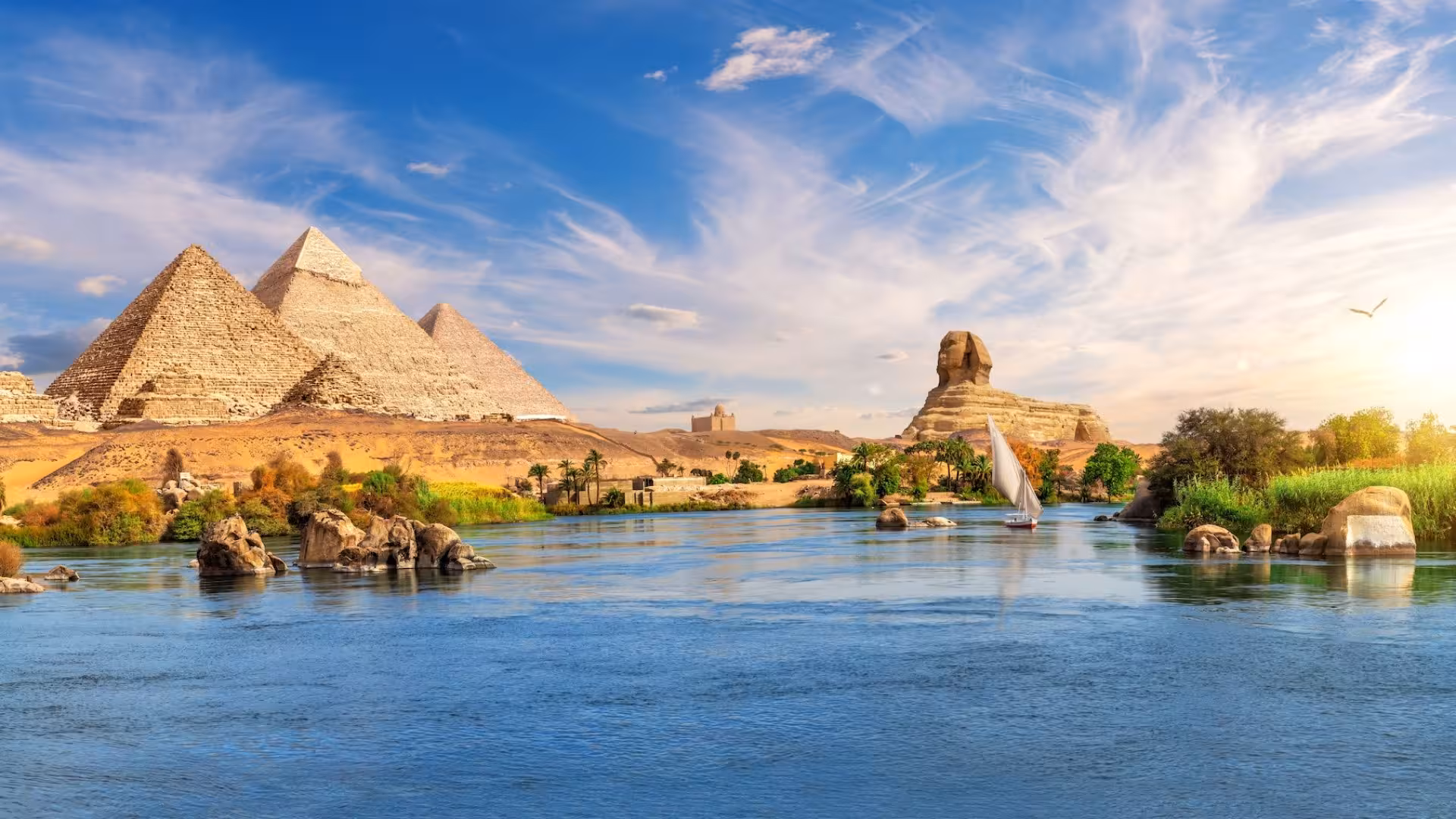Giza Pyramids and the Sphinx by the Nile with a felucca sailboat, highlight of 15-day private Egypt tour from Marsa Alam
