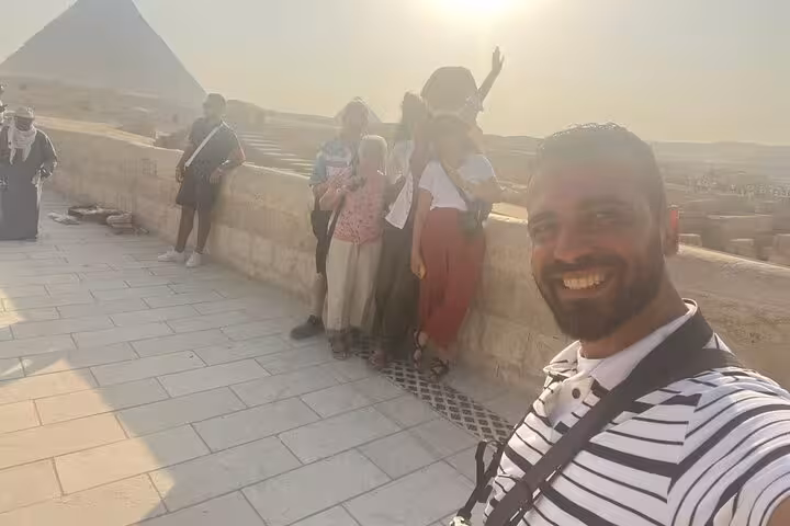Tour guide selfie with guests at Giza Pyramids viewpoint, private Cairo pyramid and Sphinx day tour