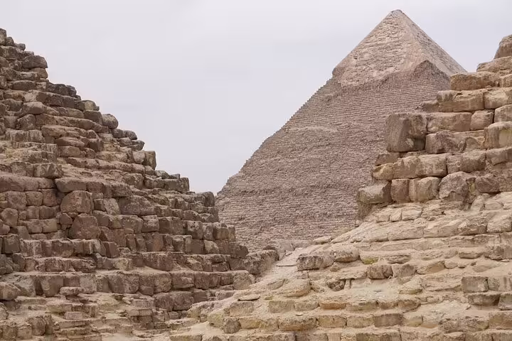 Stone passages between Giza pyramids, ancient limestone blocks on Port Said shore excursion to Cairo highlights