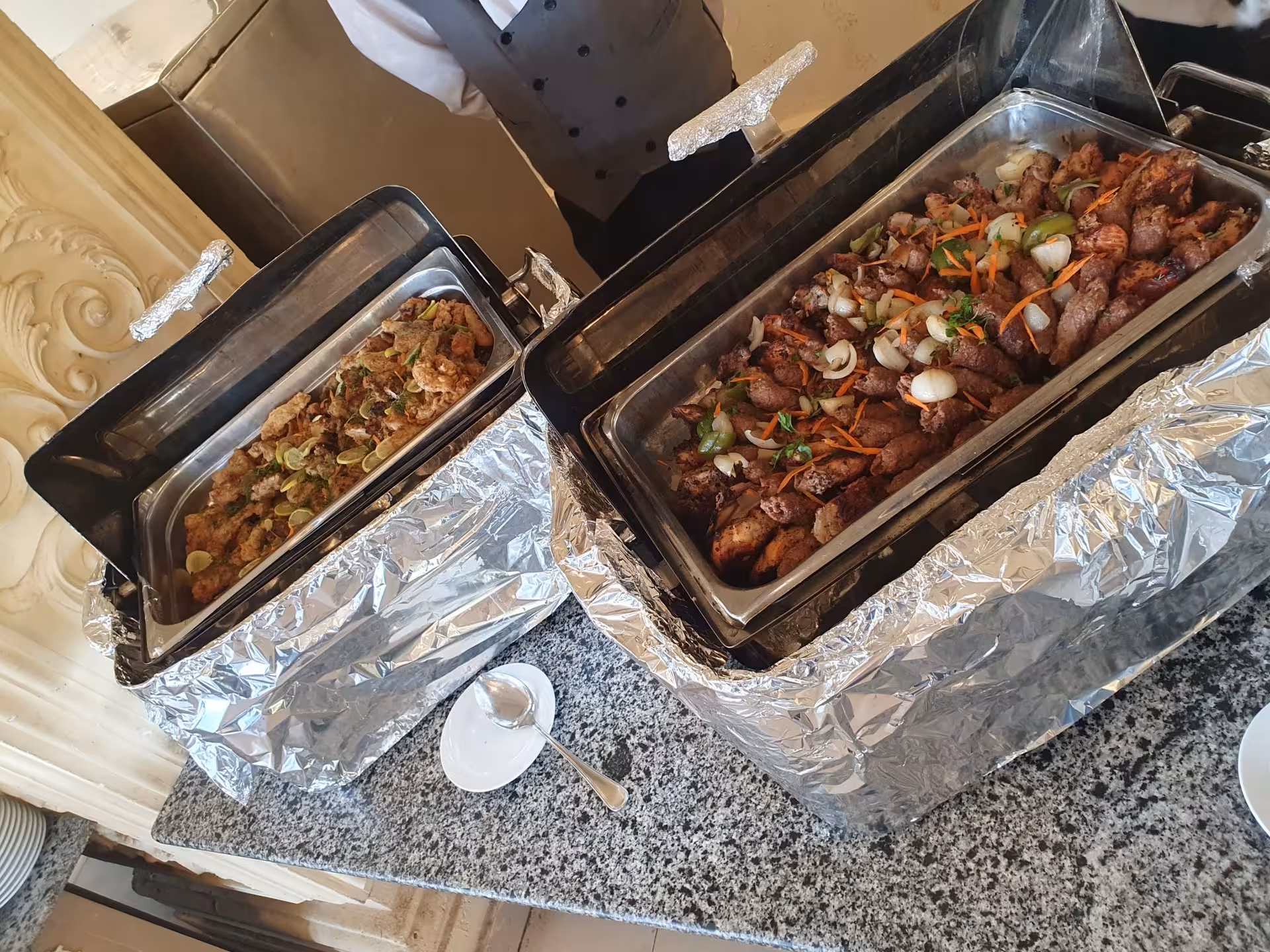 Buffet lunch with grilled meat and rice dishes served in chafing dishes during Giza Pyramids full-day tour