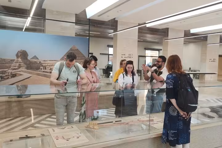 Tour group viewing Giza site model in museum, part of Half-Day Pyramids Tour with 9-pyramids viewpoint