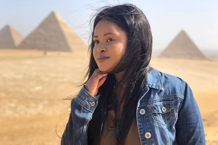 Traveler portrait with Giza pyramids backdrop, perfect for private tour with ATV quad biking and camel ride