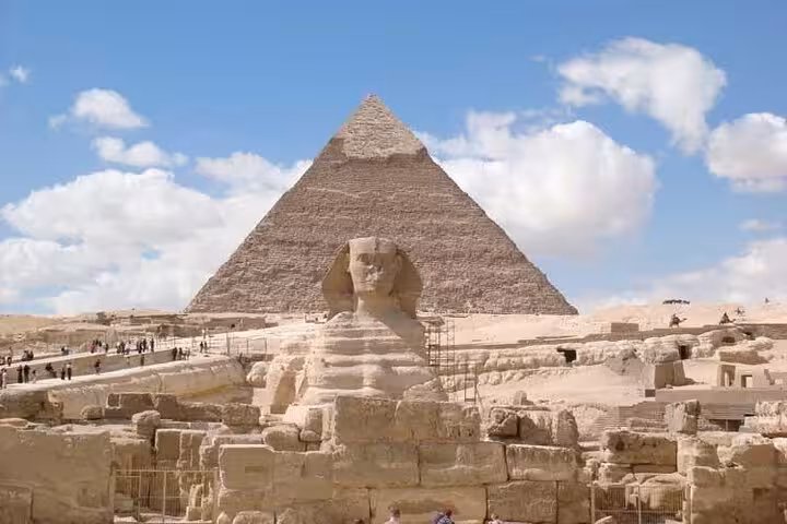 Great Sphinx with the Pyramid of Khafre behind, captured on an all-inclusive Giza tour with pyramid entry and camel ride