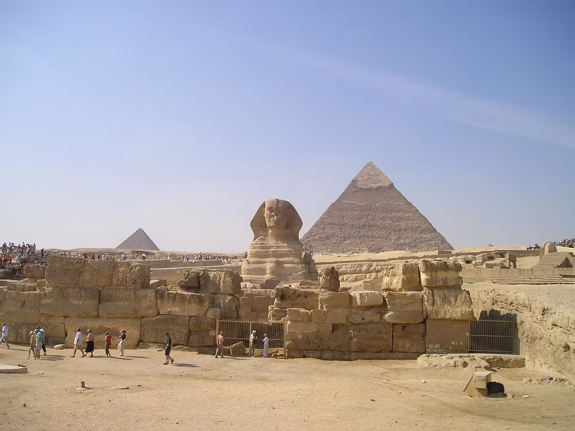 Great Sphinx of Giza with Pyramid of Khafre and tourists at the Giza Plateau, Egypt