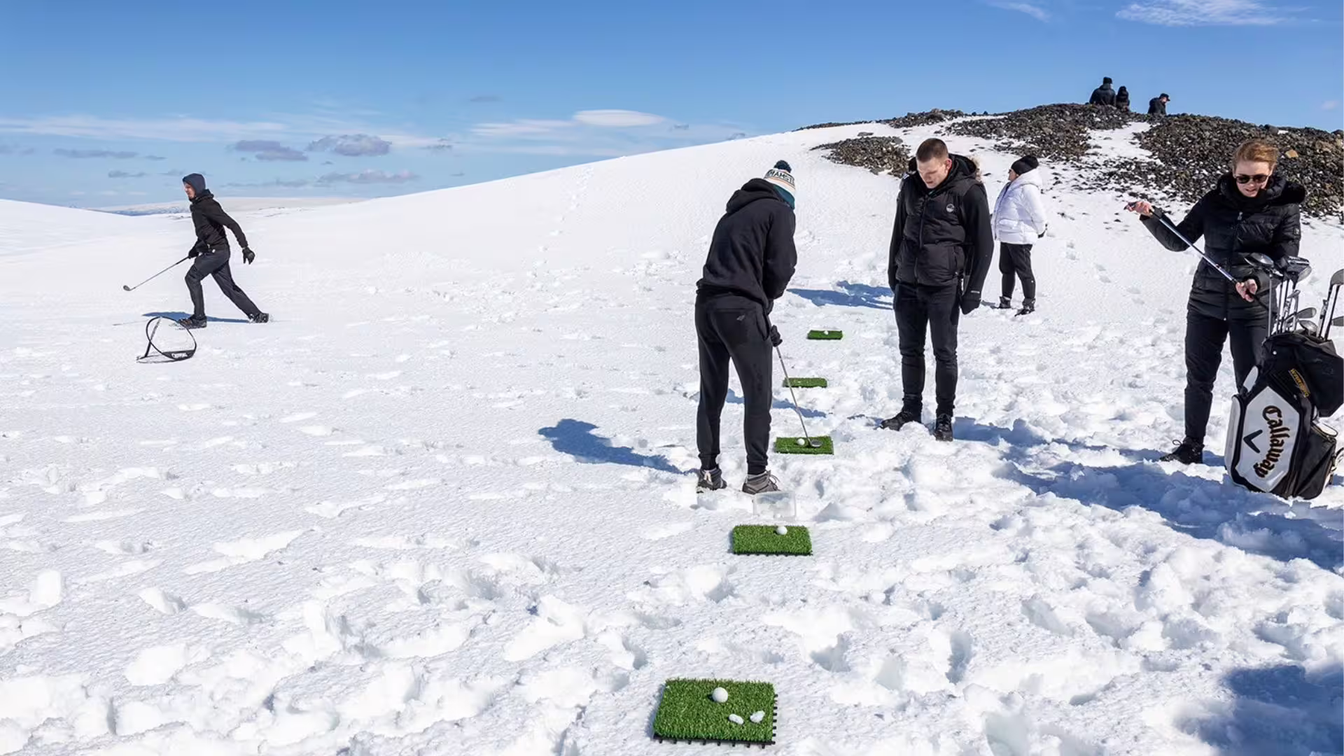 Experience the unique thrill of playing glacier golf atop the icy expanse.