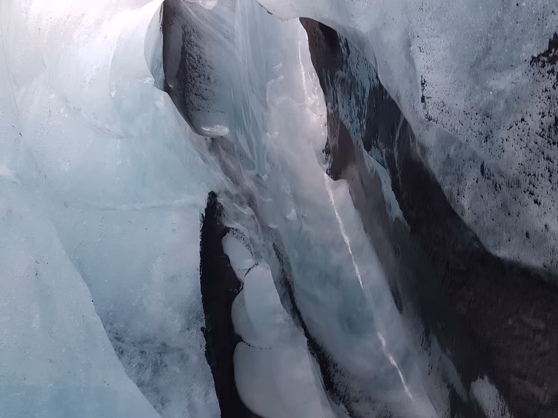 Close-up of glacier ice formations and crevasses during ice climbing tour in Iceland