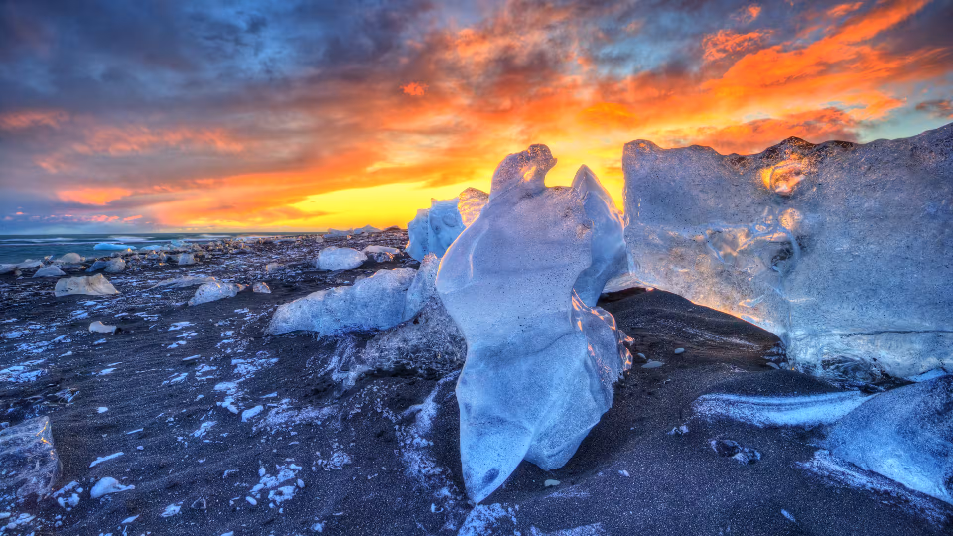 Icebergs on Diamond Beach at sunrise, Iceland Glacier Lagoon private rally car adventure photo stop