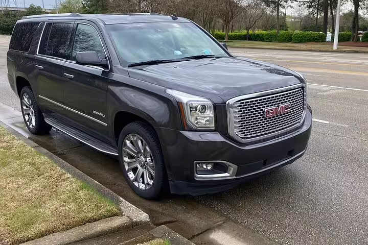 Premium GMC Yukon Denali SUV offering reliable private transfer from Managua Airport to Managua City round trip.