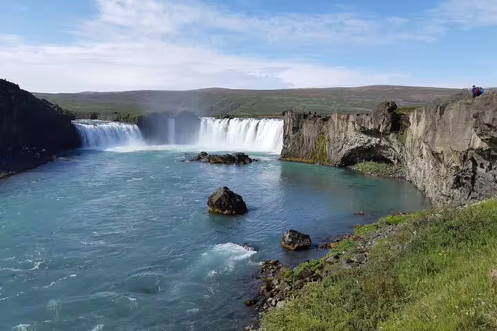 Godafoss waterfall cascading into turquoise glacial river near Lake Myvatn, Iceland