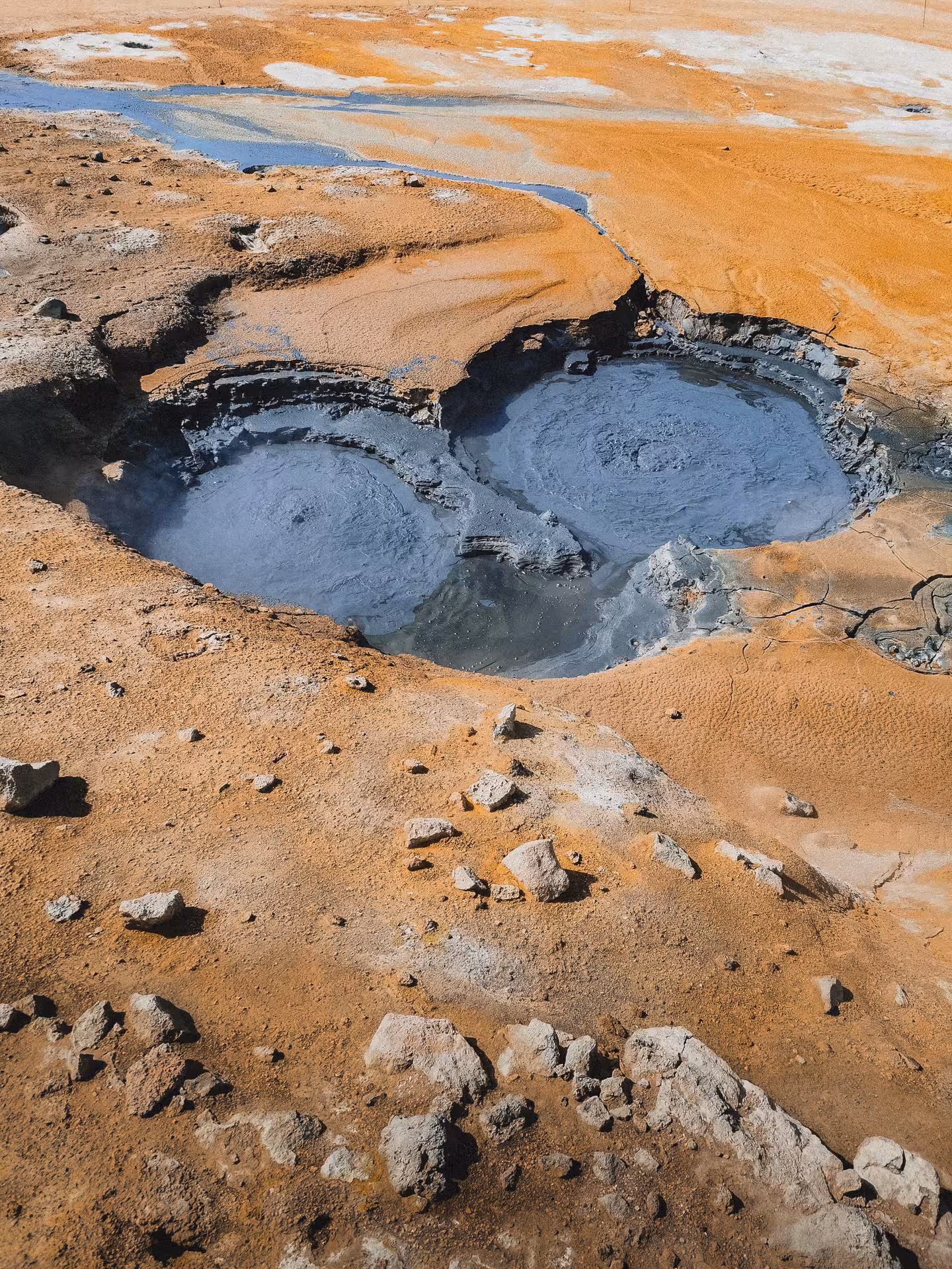 Bubbling mud pots at Hverir geothermal area, Lake Mývatn, on Akureyri shore tour with Goðafoss and baths