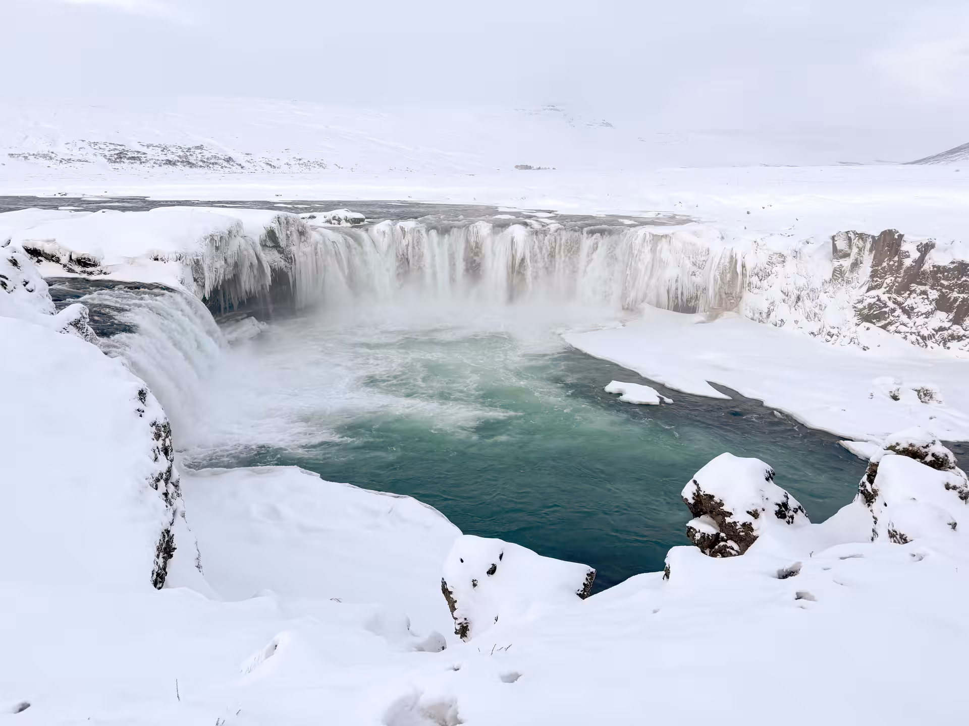 Panoramic winter view of Goðafoss Waterfall, North Iceland, a highlight of the Northern Wonders day tour