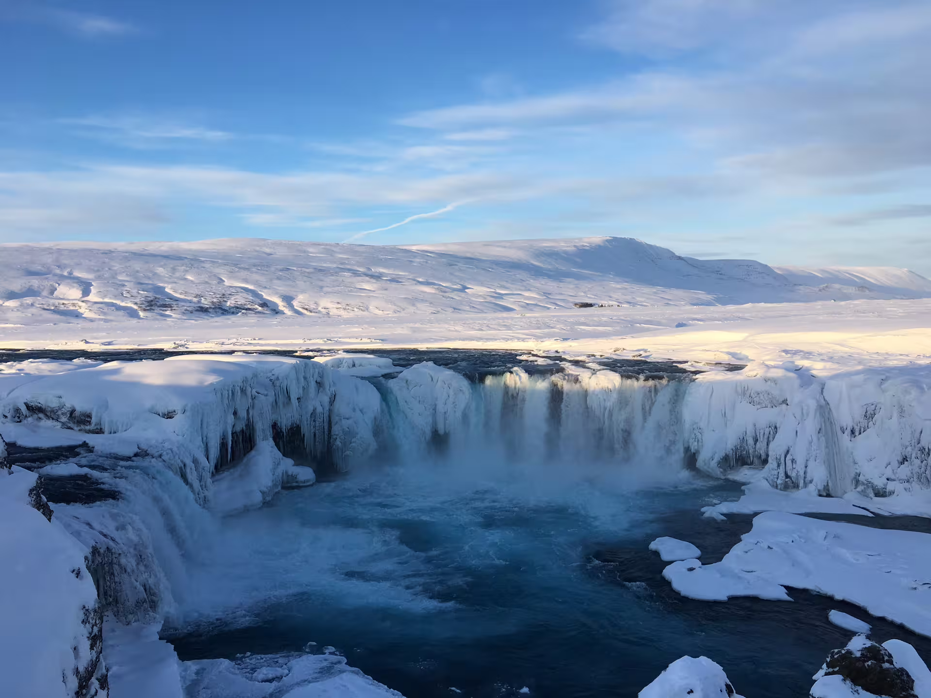 Godafoss waterfall in winter with snow and ice formations near Myvatn, Iceland