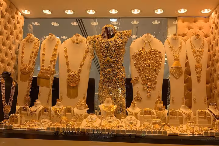 Gold Souk jewelry window in Deira, Old Dubai shopping stop on guided walking tour with tastings