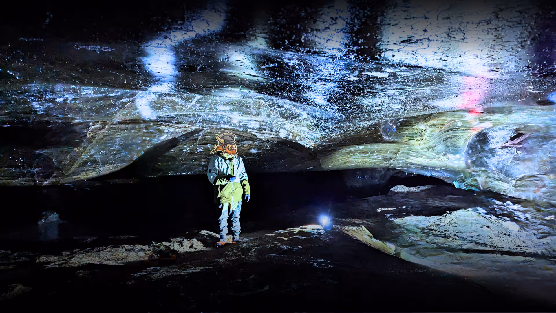 Traveler inside a blue ice cave on Golden Circle & ice cave monster truck tour from Reykjavik, Iceland