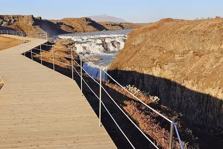 Wooden boardwalk overlook of Faxi waterfall on Iceland's Golden Circle tour route