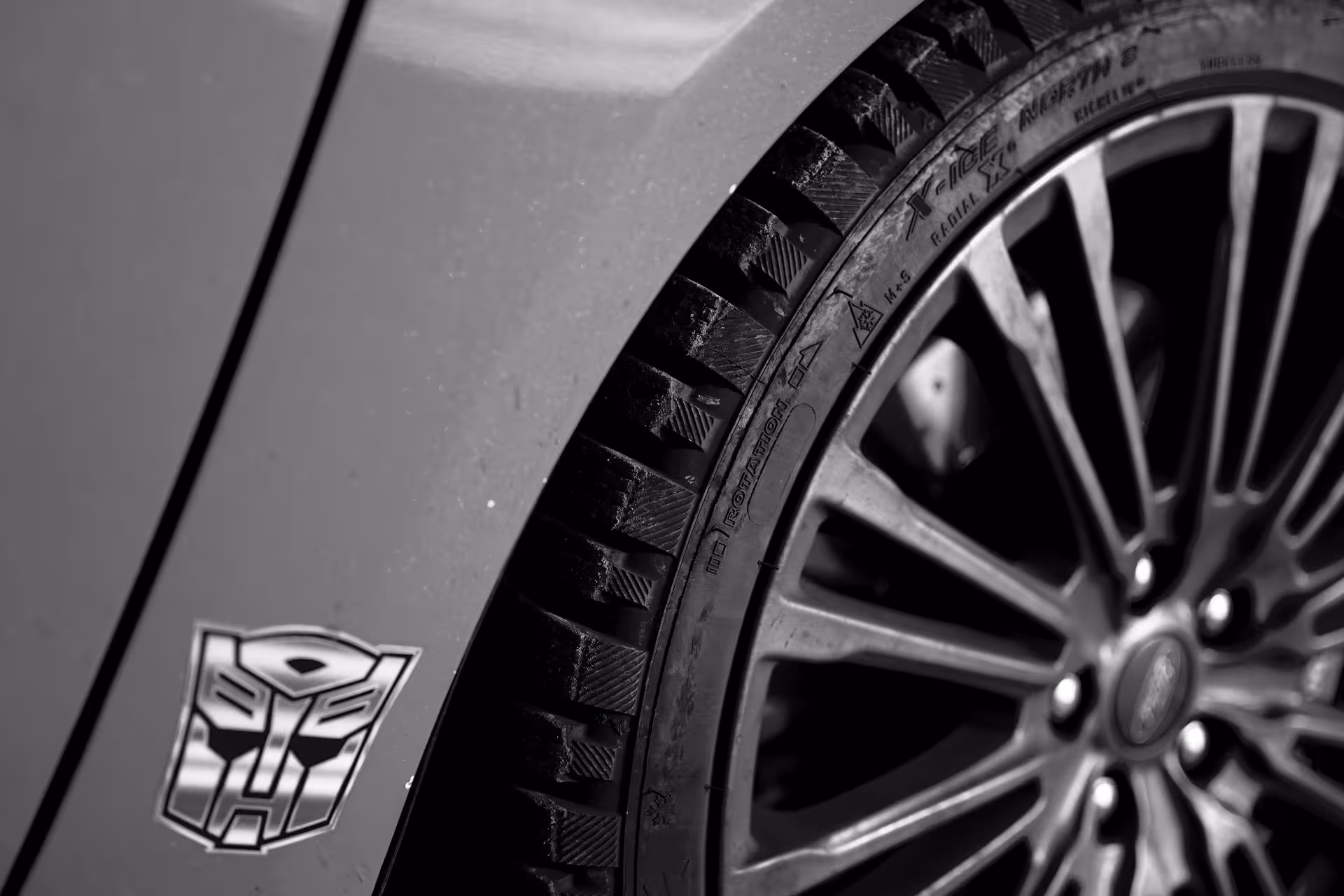 Close-up of studded winter tire and alloy wheel on rally car for Golden Circle Rally Car Experience Iceland