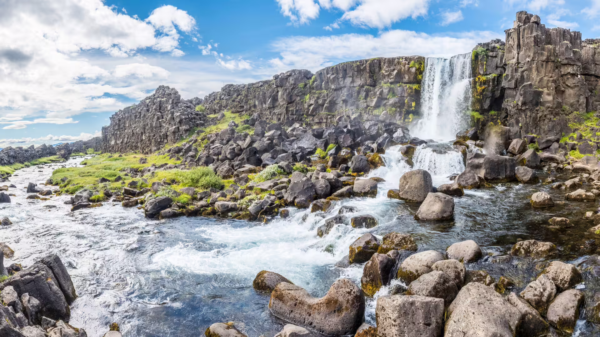 A small waterfall running into a creek. 