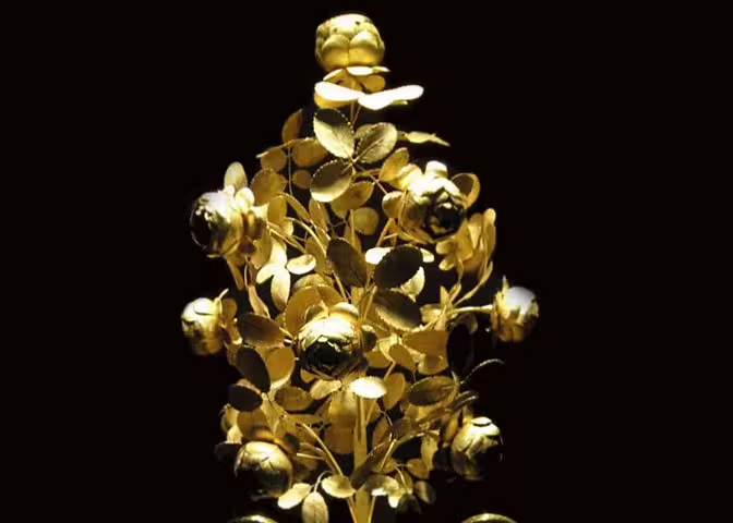 Intricate golden floral artifact from the Imperial Treasury, showcasing exquisite craftsmanship and luxury.