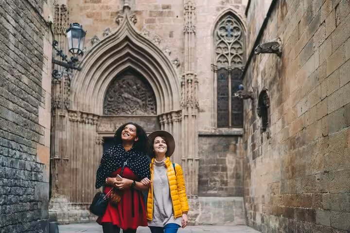 Travelers admiring Barcelona Cathedral on a Gothic Quarter Old Town walking tour through medieval streets