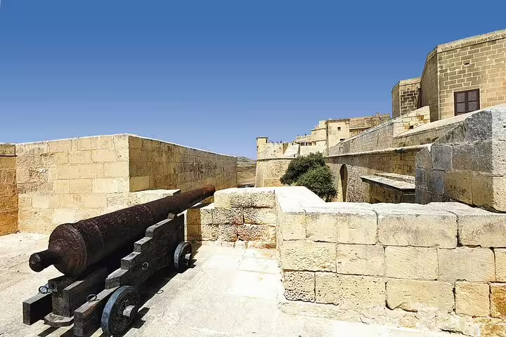 Ancient cannon at Gozo Citadel fortress walls on a UNESCO heritage small group guided tour in Gozo