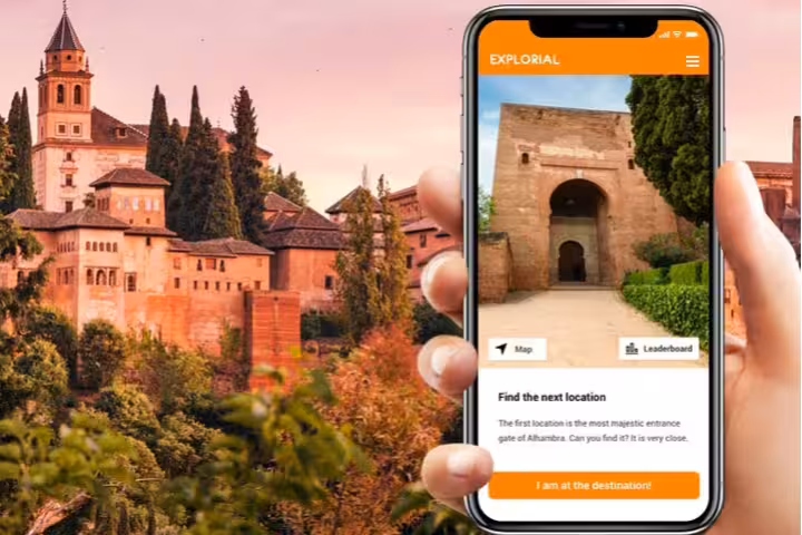 Phone app guides Granada Alhambra self-guided scavenger hunt tour with map clues at the entrance gate