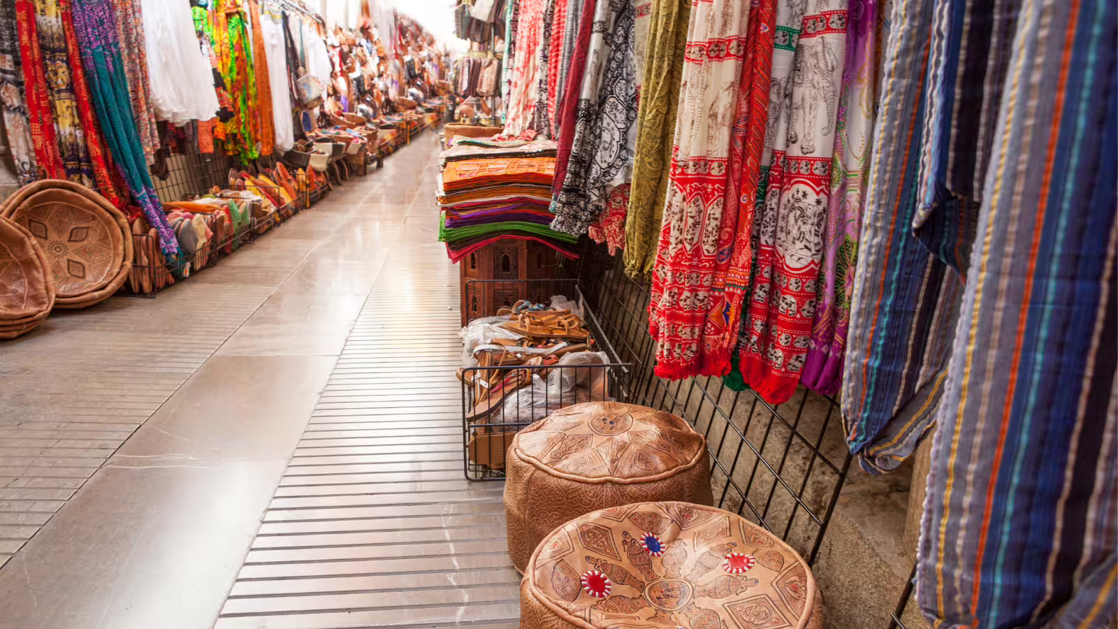 Granada souk market near Alhambra, colorful textiles and leather goods on a private tour with hotel pick-up