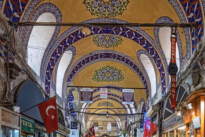 Grand Bazaar vaulted corridor with colorful Iznik-style tiles, featured on Byzantine and Ottoman city tour