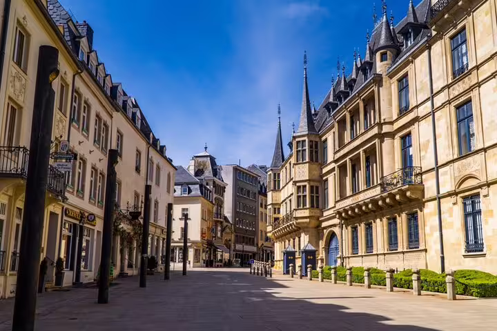 Grand Ducal Palace and historic stone buildings on a sunny plaza in Luxembourg City