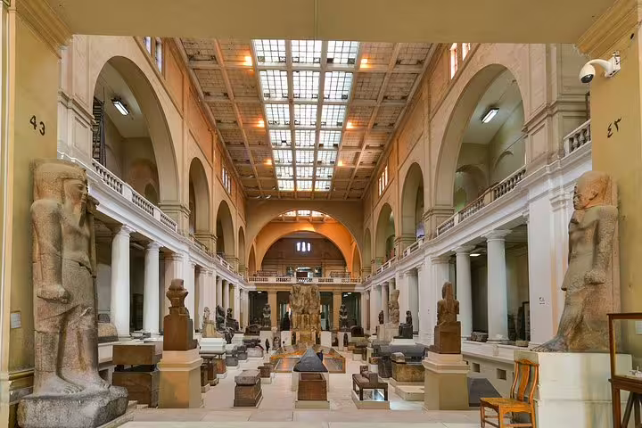 Grand Egyptian Museum gallery in Cairo with ancient statues, ideal stop on a Four Seasons luxury tour