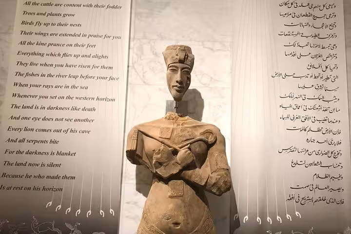 Ancient Egyptian statue inside Grand Egyptian Museum on private Giza tour with pyramids, Sphinx and ATV ride