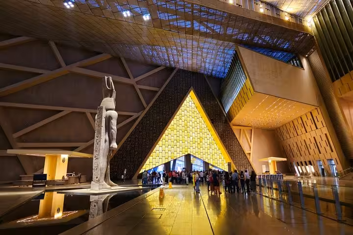 Grand Egyptian Museum entrance with pharaoh statue, included stop on TourShare all-in VIP Giza tour