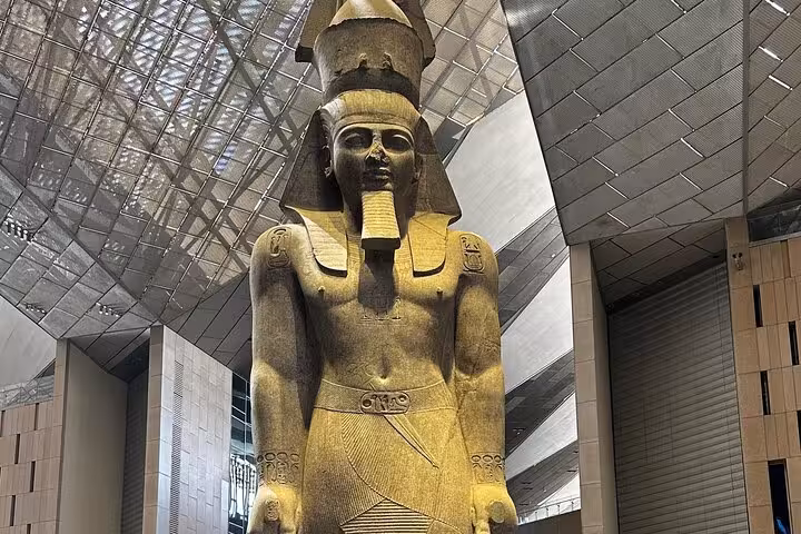 Colossal pharaoh statue inside the Grand Egyptian Museum in Cairo on a guided GEM and Giza tour with lunch