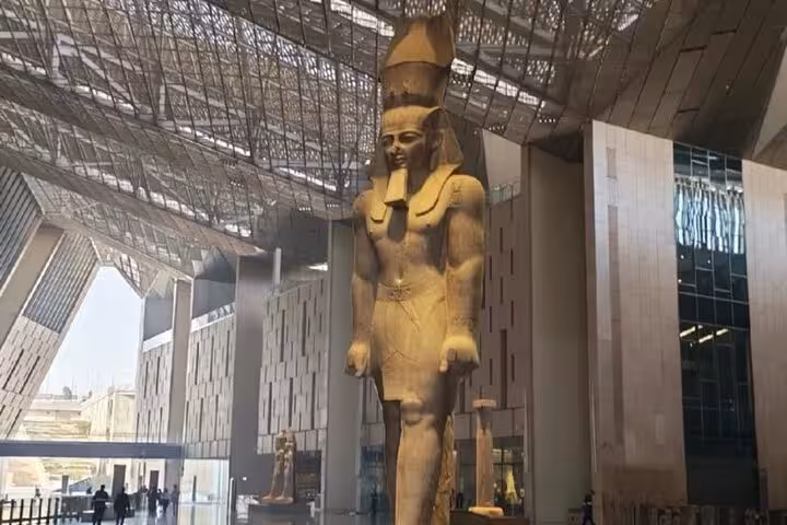 Cairo Grand Egyptian Museum guided private tour showing the colossal Ramses II statue under glass roof