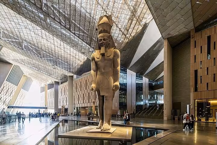 Grand Egyptian Museum atrium with Ramses II statue, included on half-day tour with tickets and lunch