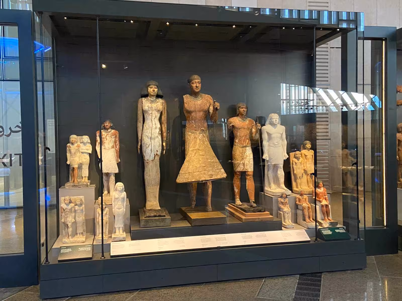 Ancient Egyptian statues display inside the Grand Egyptian Museum on a full-day Giza Pyramids tour including lunch
