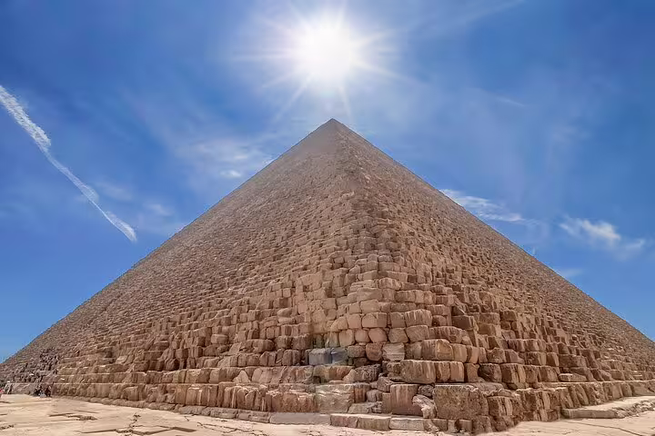 Close-up view of the Great Pyramid of Giza under bright sun, private Cairo day tour to Giza and Memphis