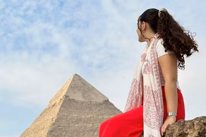 Traveler gazing at the Great Pyramid of Giza on a Grand Egyptian Museum tour with lunch in Cairo