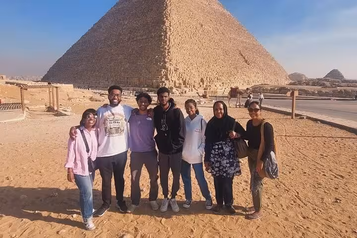 Group photo at the Great Pyramid of Giza on a private 3-day Cairo Giza Alexandria tour with city sightseeing