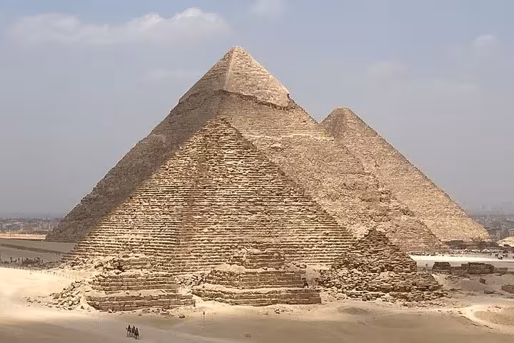 Close view of the Great Pyramid of Giza with surrounding desert ruins, must-see ancient wonder tour