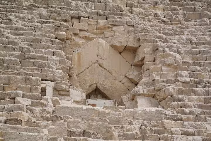Close-up of ancient stone blocks on the Great Pyramid of Giza, highlight of Hurghada to Cairo day tour