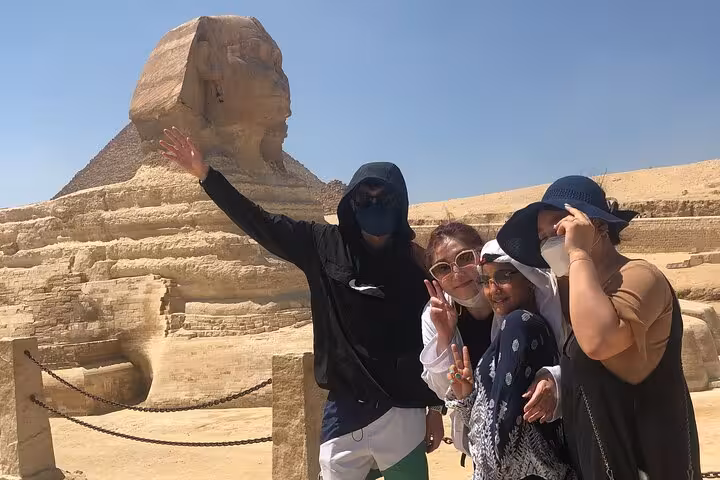 Friends posing by the Great Sphinx in Giza, part of a 3-day Cairo, Giza and Alexandria private tour