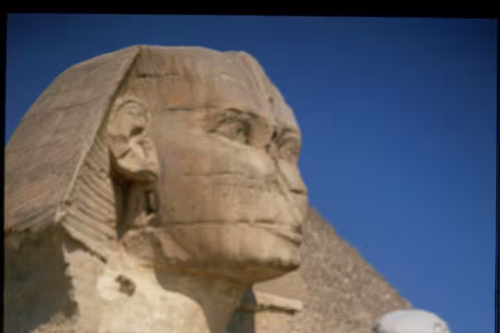 Great Sphinx of Giza with pyramid backdrop on Cairo bus trip from Sharm El Sheikh to Pyramids tour