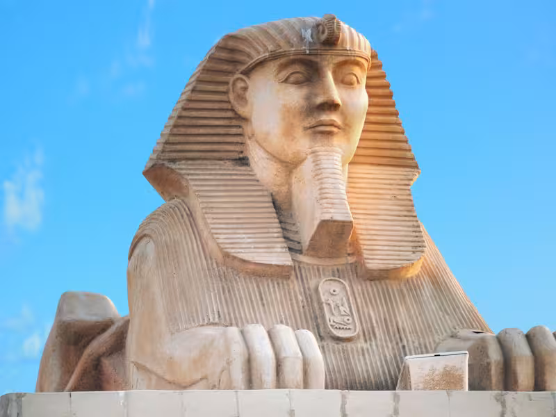 Close-up of the Great Sphinx at Giza under blue sky, must-see landmark on Golden Egypt tour package